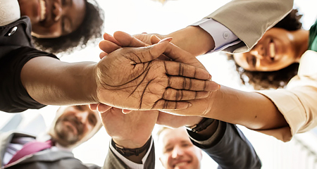 Group with all hands in.