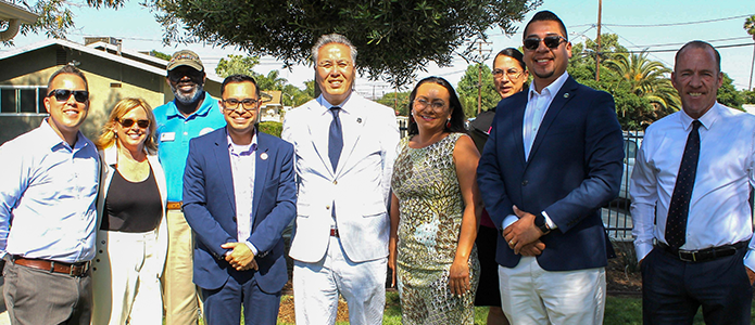 Congressman Mark Takano  and city and county leaders at the Myers Park apartments.