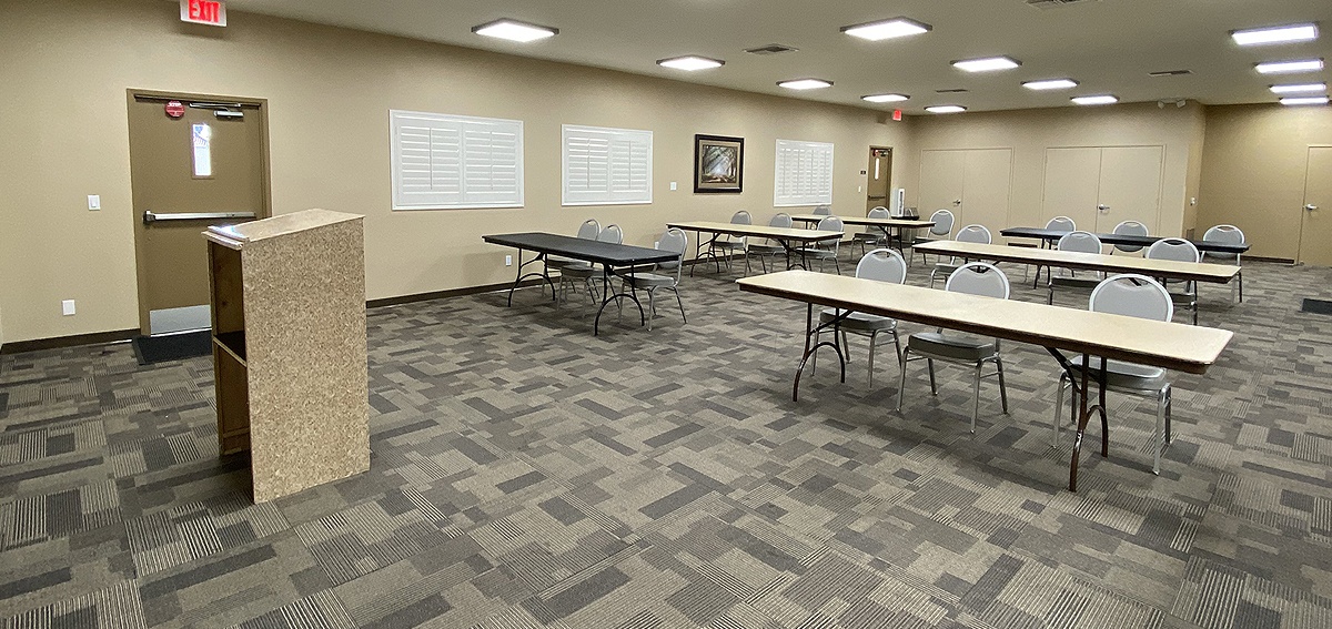 The meeting room set up for a business meeting.